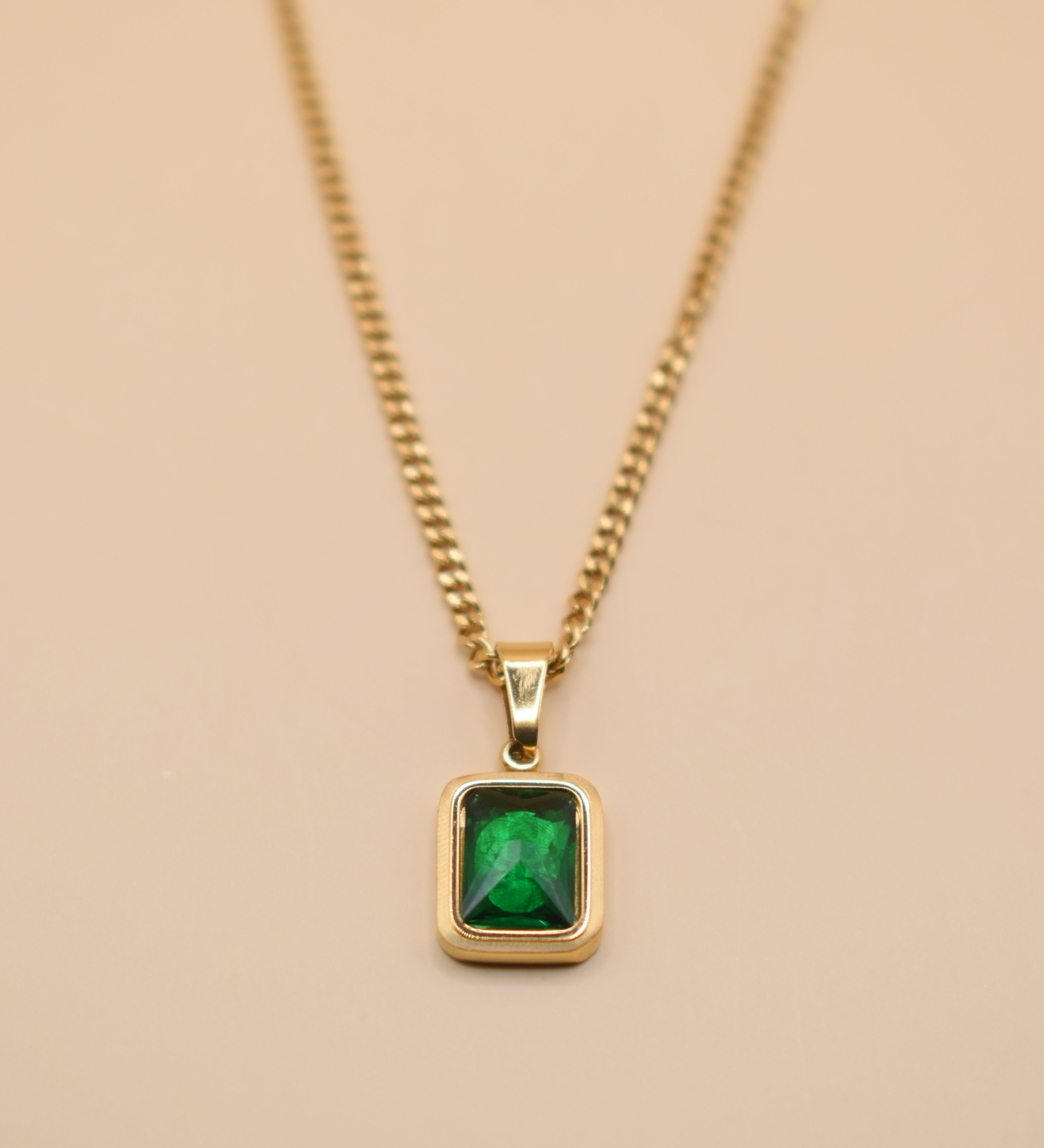 Green pendant necklace with gold chain and inlay stone