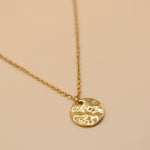 Hammered gold round pendant necklace on dainty gold chain