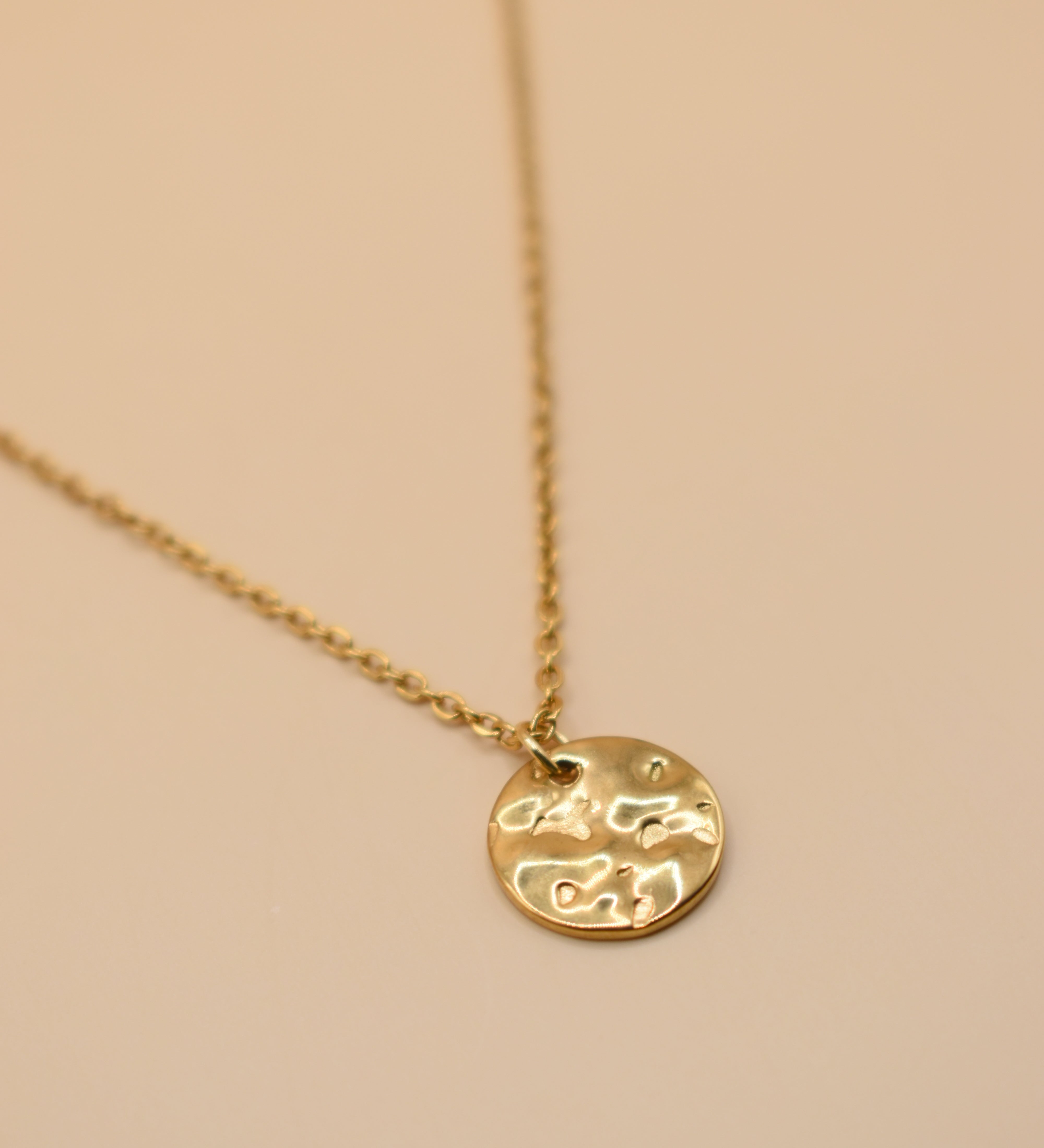 Hammered gold round pendant necklace on dainty gold chain