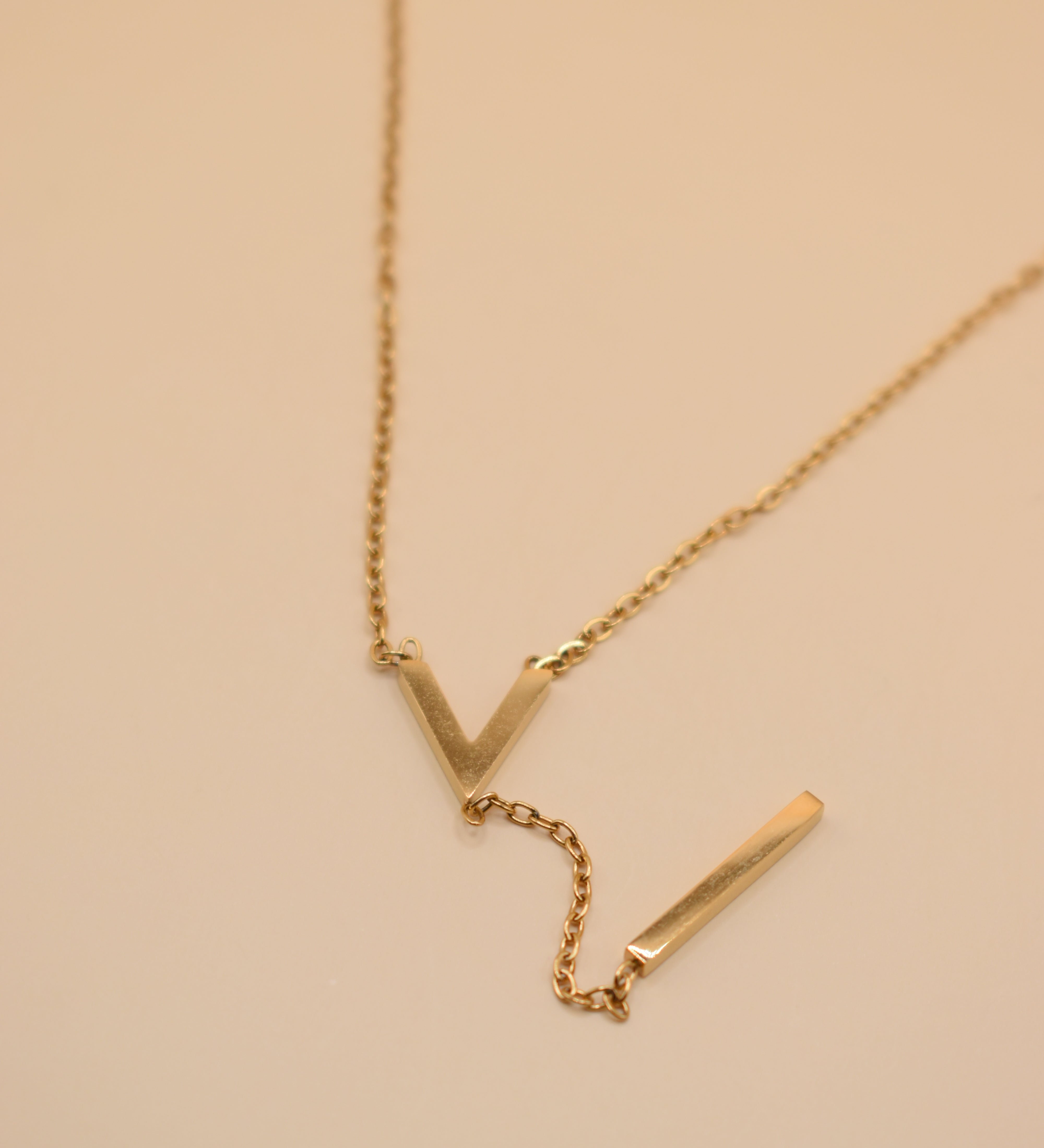 Gold pendant drop necklace with minimalist V-shape chain