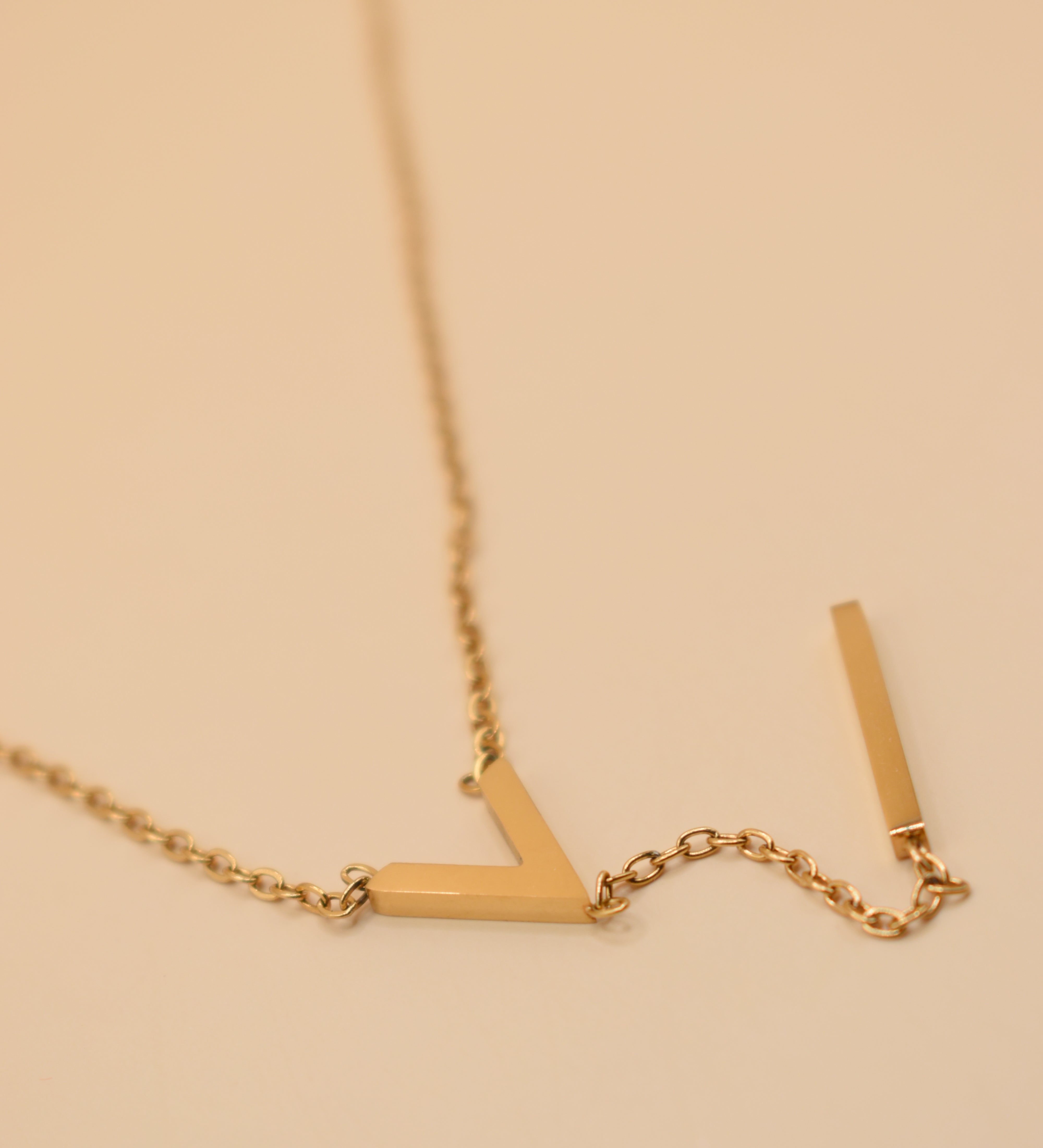 Gold pendant drop necklace with minimalist V-shape chain