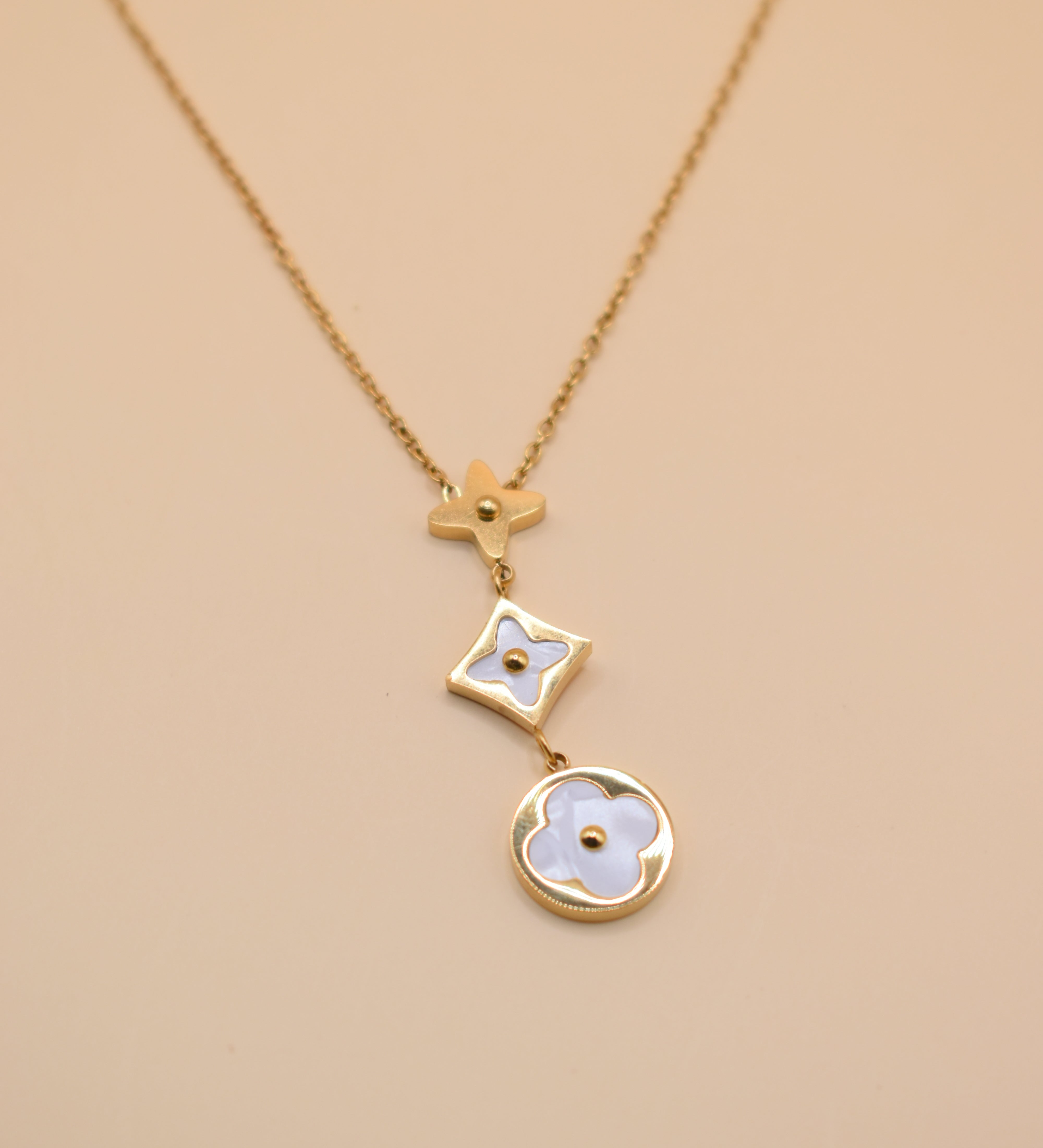 White flower pendant on dainty gold necklace chain