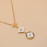 White flower pendant on dainty gold necklace chain