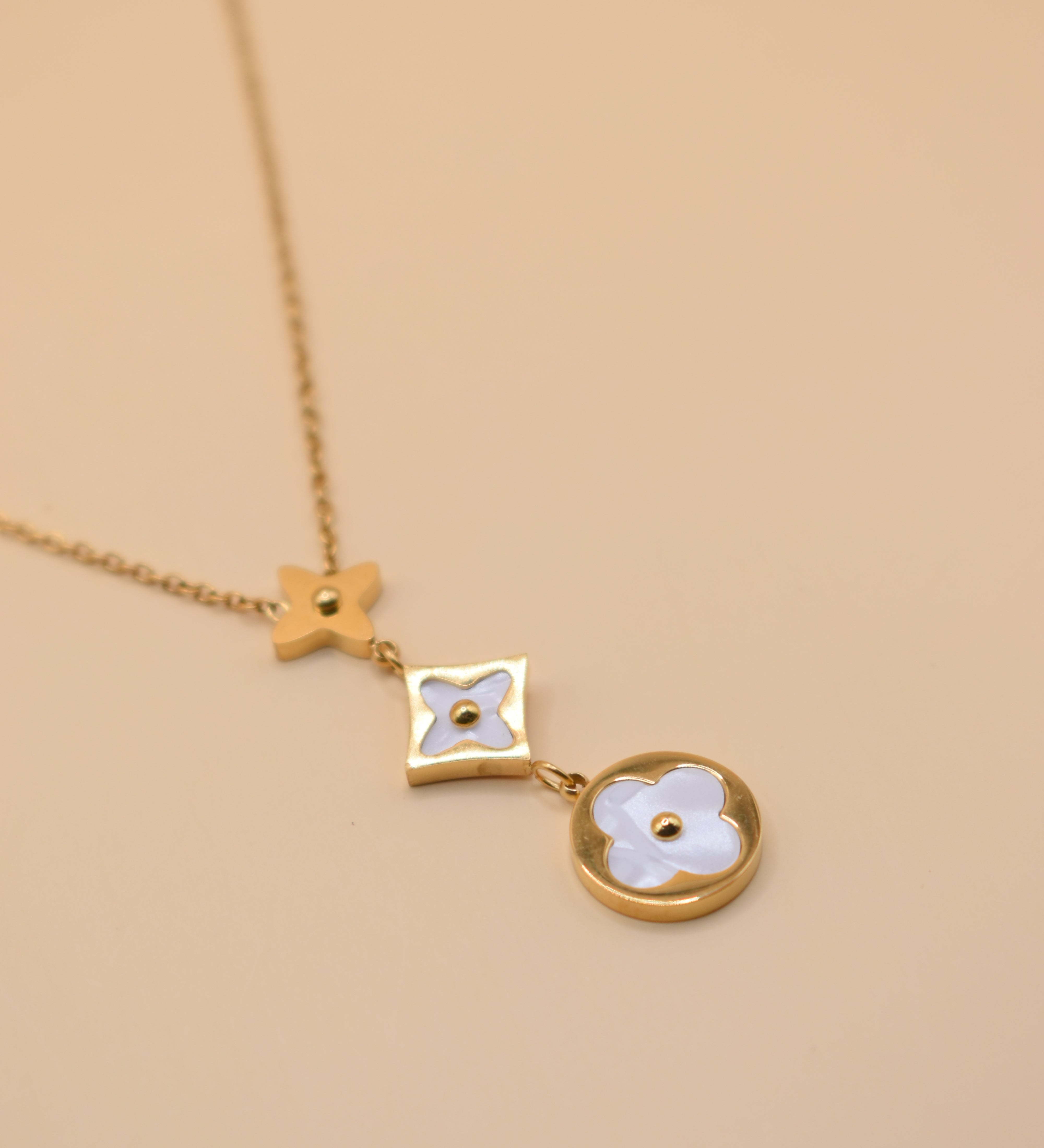 White flower pendant on dainty gold necklace chain
